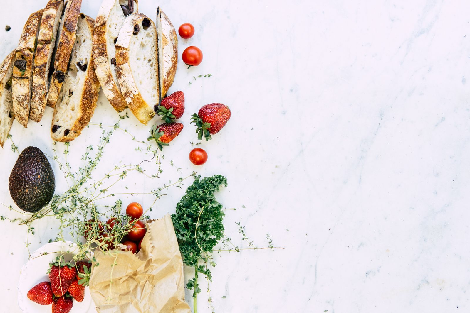 Healthy ingredients including avocado and lean protein on a table