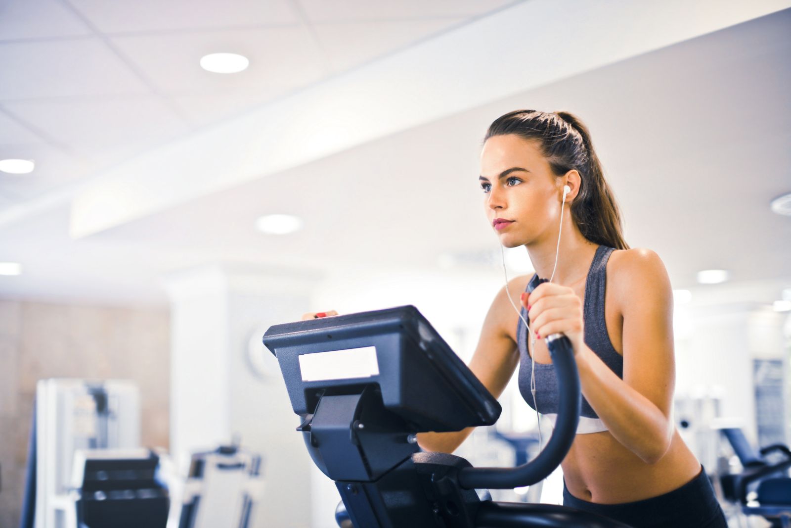 Woman walking on a treadmill at the gym